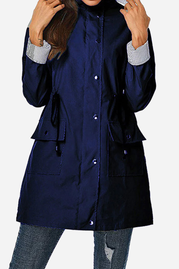 Women's water resistant striped hooded windbreaker jacket with oversized fit and multiple pockets