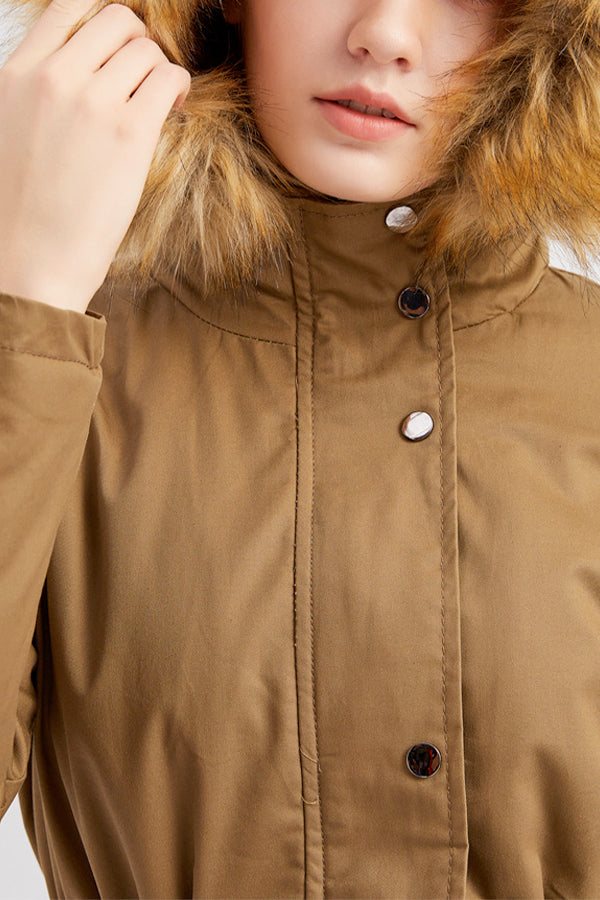 Close-up of large hooded velvet coat with fur-trimmed hood in brown color