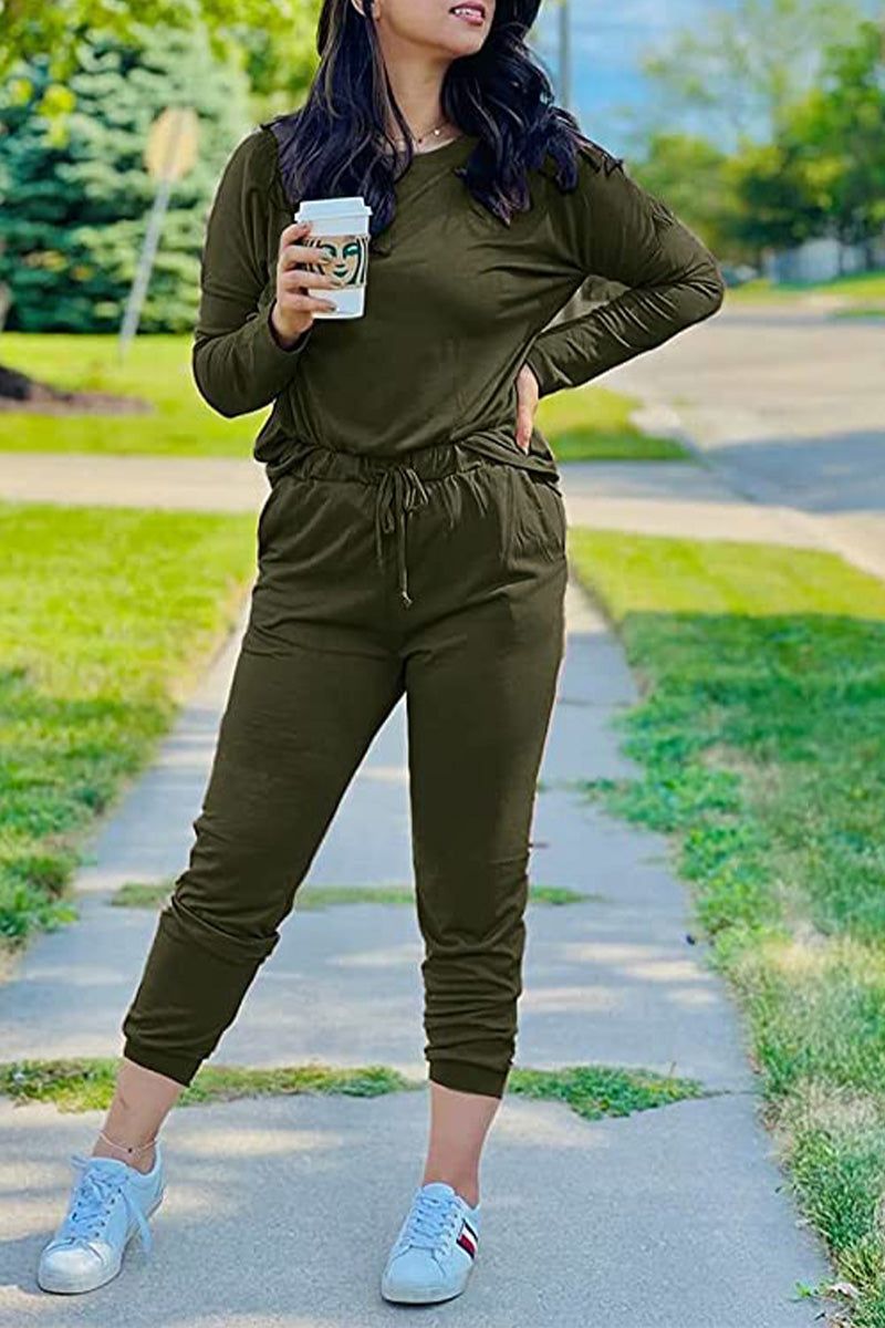 woman wearing cozy chic two-piece sweatsuit set with long-sleeve top and high-waisted pants with pockets in neutral beige color