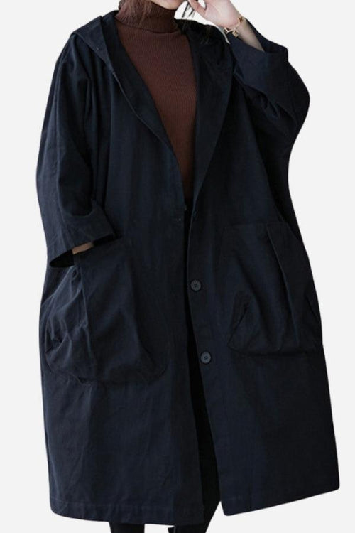 Black oversized water resistant windbreaker jacket with pockets and button closure