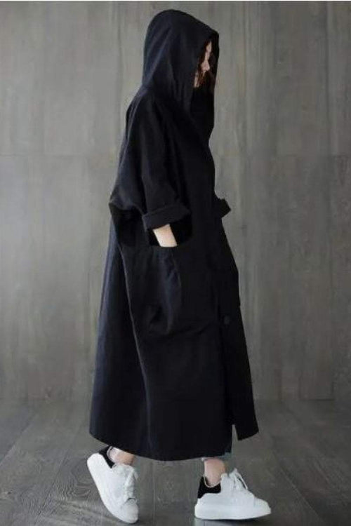 Black oversized water resistant windbreaker jacket with hood and pockets, styled for Halloween collection