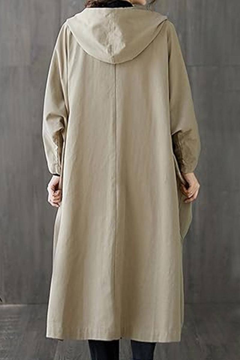 Back view of oversized beige water resistant windbreaker jacket with hood and long sleeves
