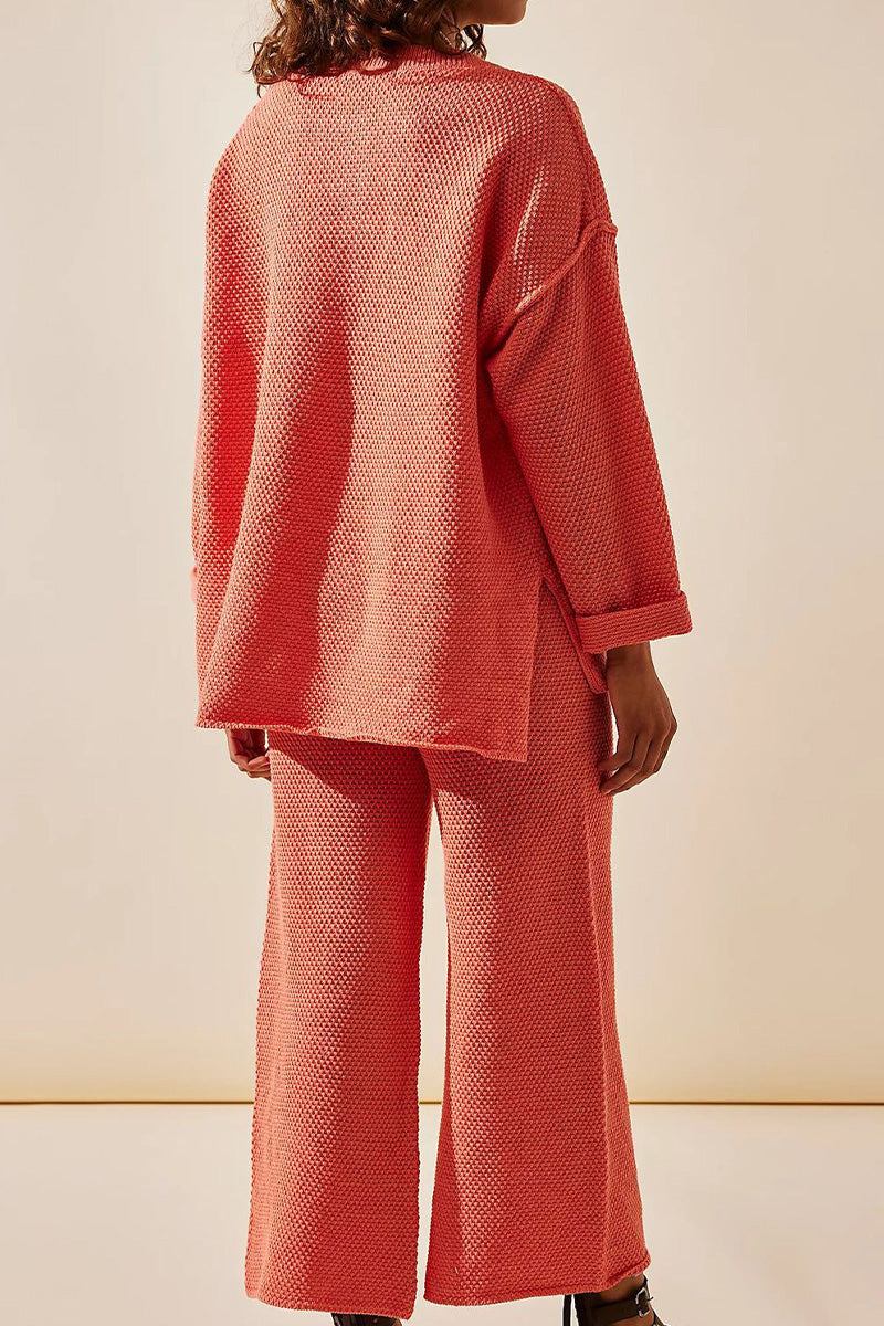 Back view of a woman wearing a coral textured two-piece oversized set with relaxed fit pants and long sleeves, designed for multi-weather comfort.
