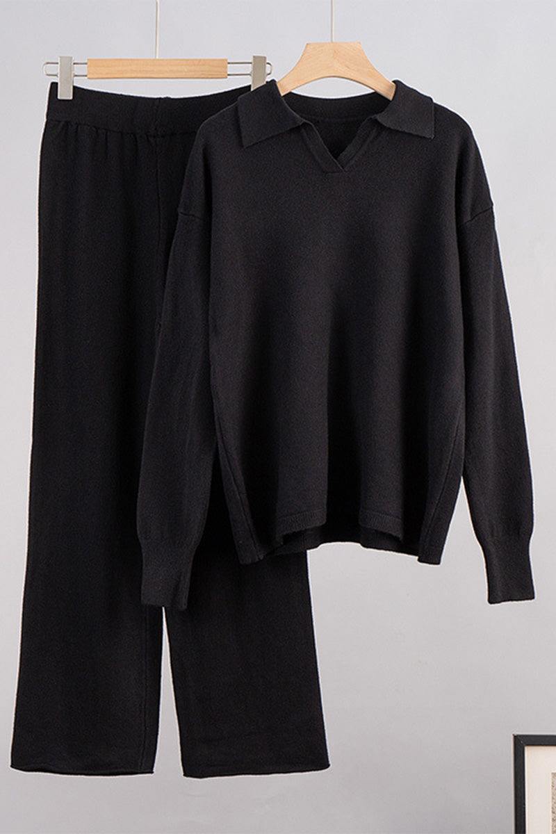 black plush and preppy two-piece set with polo collar and wide-leg pants hanging on wooden hangers