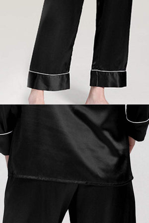 Black long sleeve silk pajamas with contrast piping on cuffs and relaxed fit pants