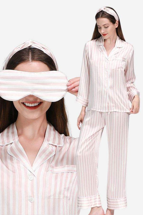 Woman wearing 100% mulberry silk striped long sleeve pajama set with matching eye mask and headband