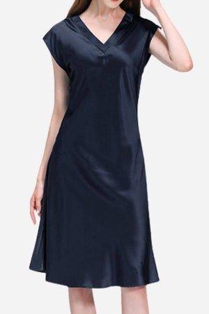 Woman wearing a black Mulberry Silk V-Neck Nightgown with short sleeves and a flowing silhouette