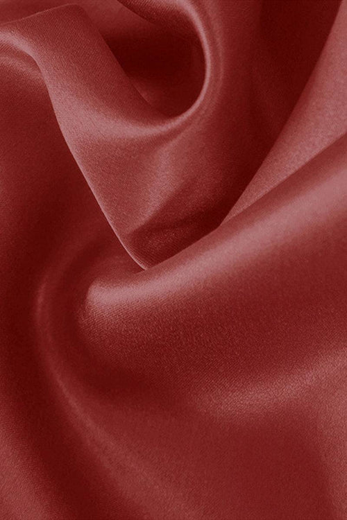 Close-up of smooth red mulberry silk fabric for elegant night dress