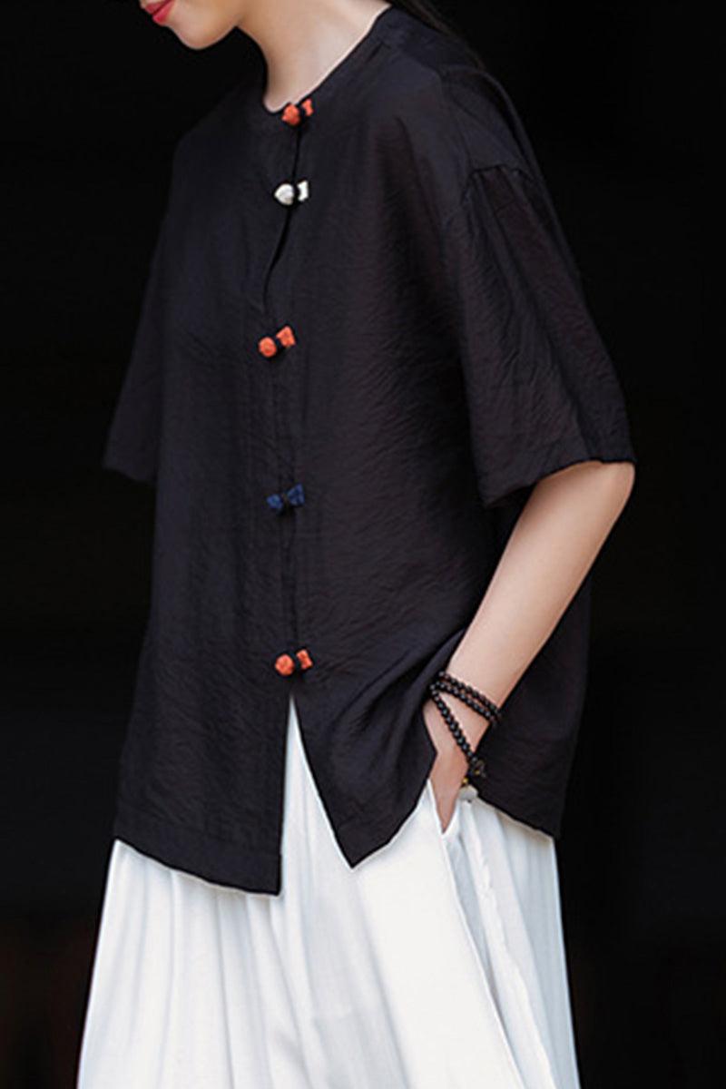 Eco-friendly regenerated cellulose blouse in black with asymmetrical buttons and oversized fit