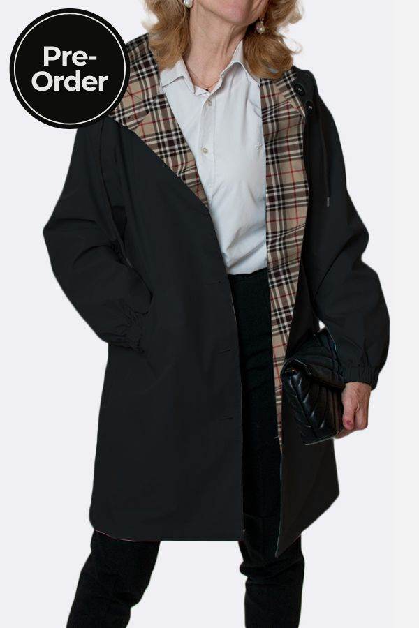 Travel-Smart waterproof hooded windbreaker with black exterior and beige plaid lining, breathable fabric, and adjustable hood for travel and everyday use.
