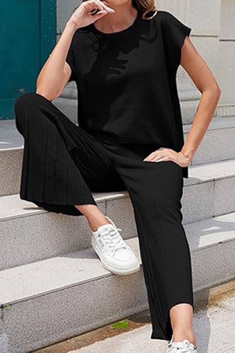 First Class Travel Comfort two-piece set in black with pleated wide-leg pants and short sleeve top, breathable wrinkle-resistant fabric for travel and everyday wear