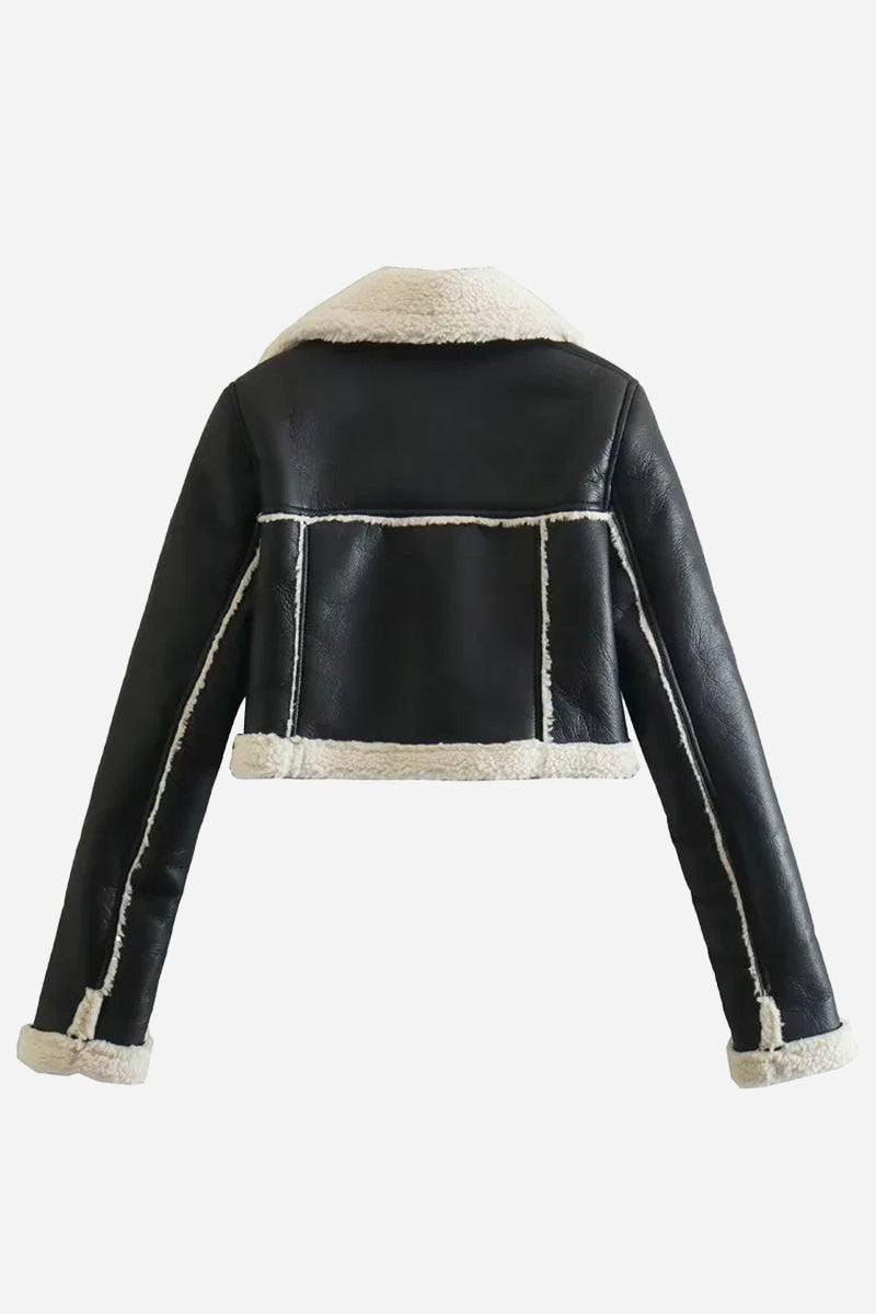 Cropped faux leather sherpa jacket with cream trim and full fleece lining, warm and stylish outerwear for casual and dressy looks.