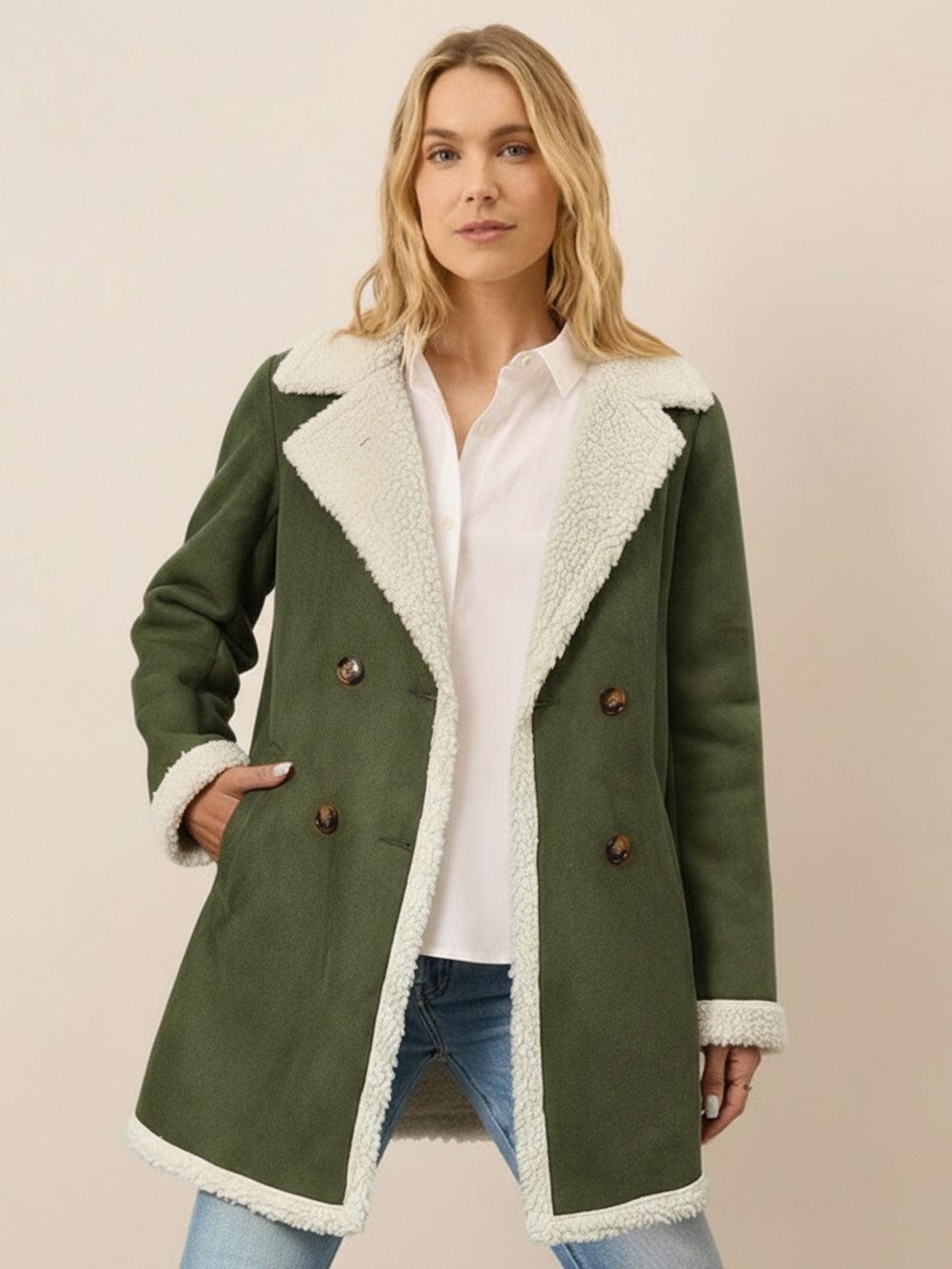 Woman wearing lightweight faux suede sherpa coat with contrast collar and double-breasted front outdoors