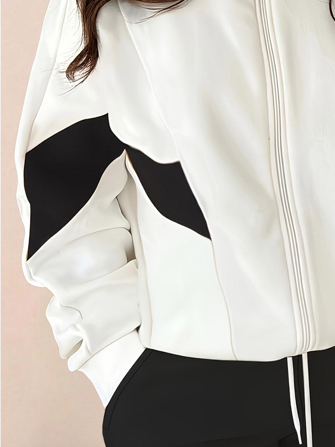 Woman wearing colorblock comfort tracksuit with contrast curved panels and relaxed fit standing outdoors