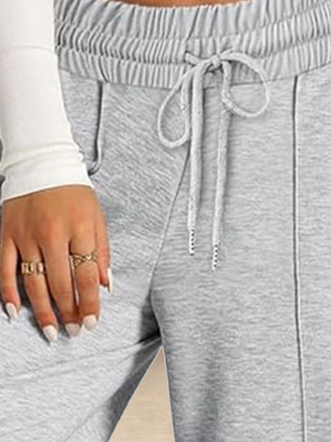 Soft knit wide-leg pants with elastic waist and side pockets for comfortable everyday wear