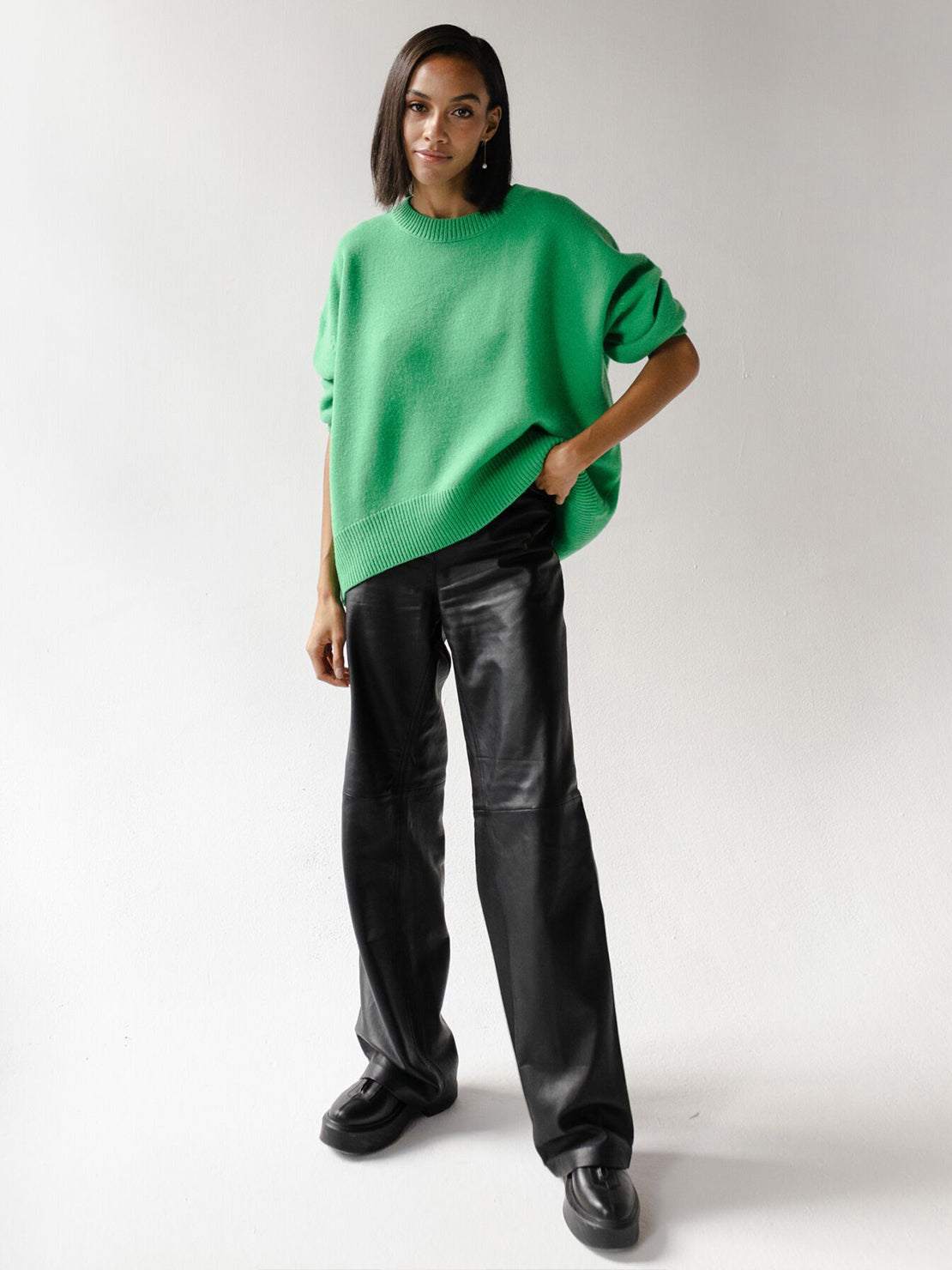 Oversized crew neck knit sweater with dropped shoulders and ribbed cuffs in neutral color