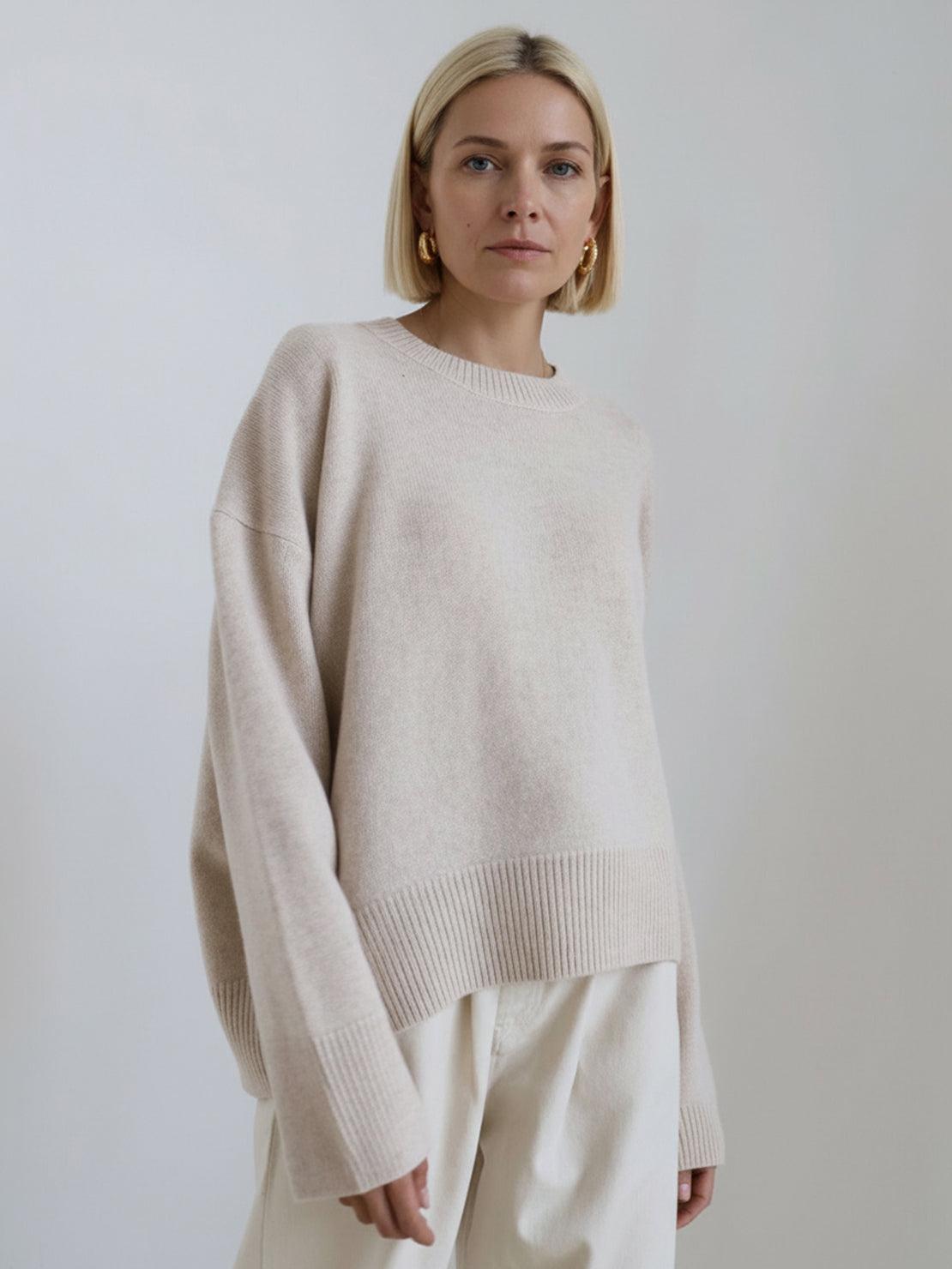 Oversized crew neck knit sweater with dropped shoulders and ribbed cuffs in neutral color