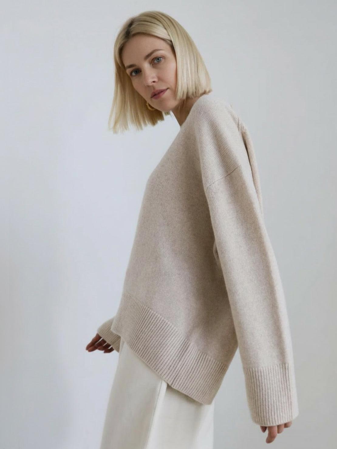 oversized crew neck knit sweater with drop shoulders and ribbed cuffs in neutral color