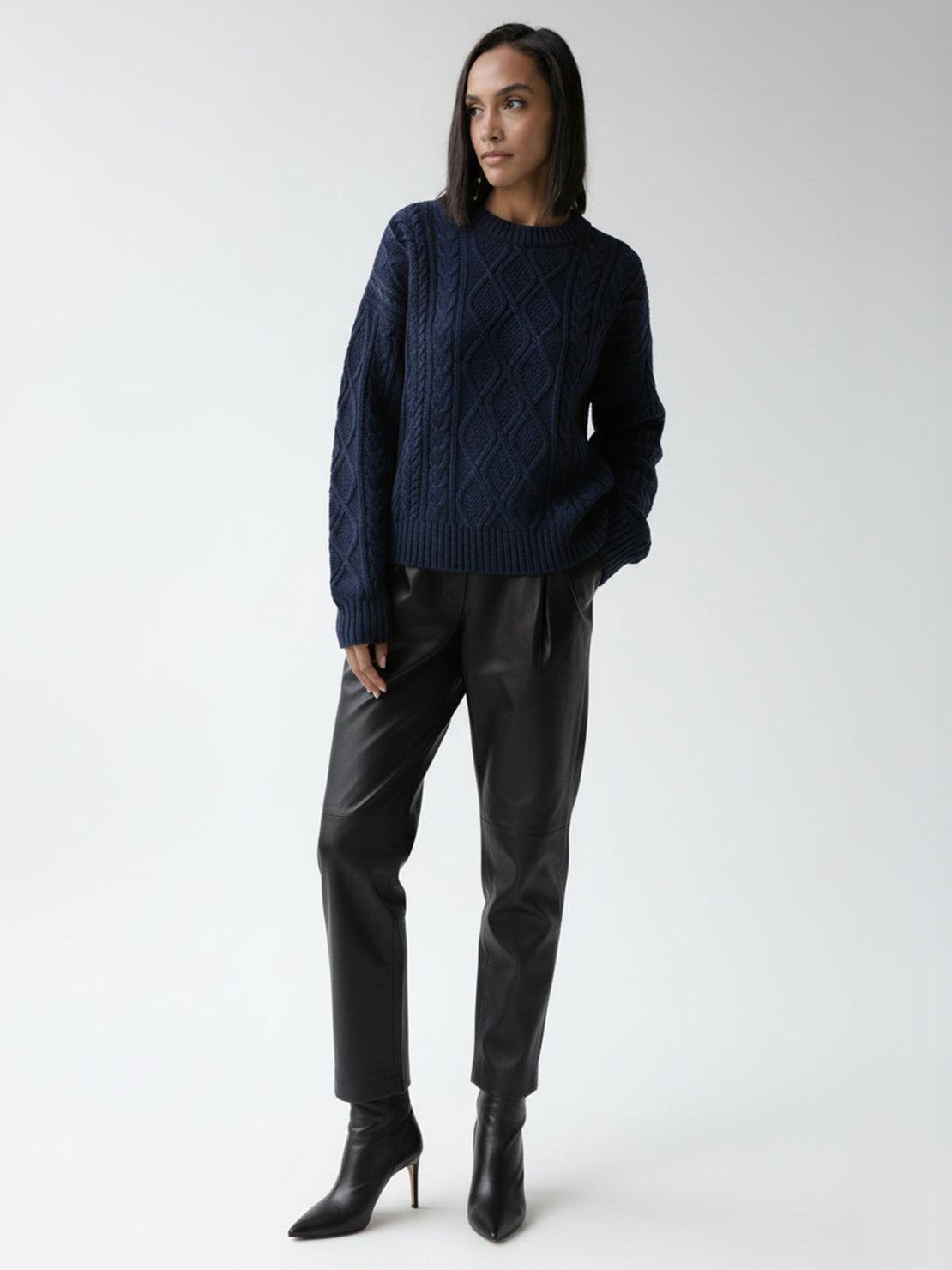 Oversized cable-knit crewneck sweater with dropped shoulders and ribbed trim in a thick plush fabric
