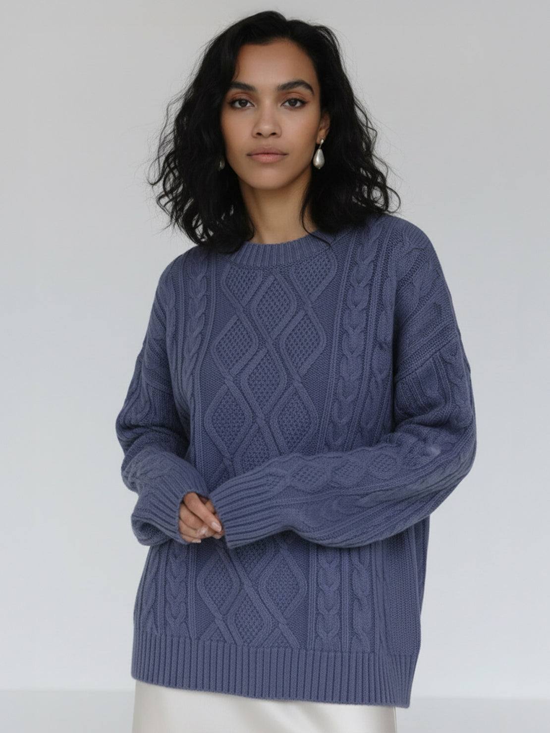 Oversized cable-knit crewneck sweater with dropped shoulders and ribbed trim in thick plush fabric
