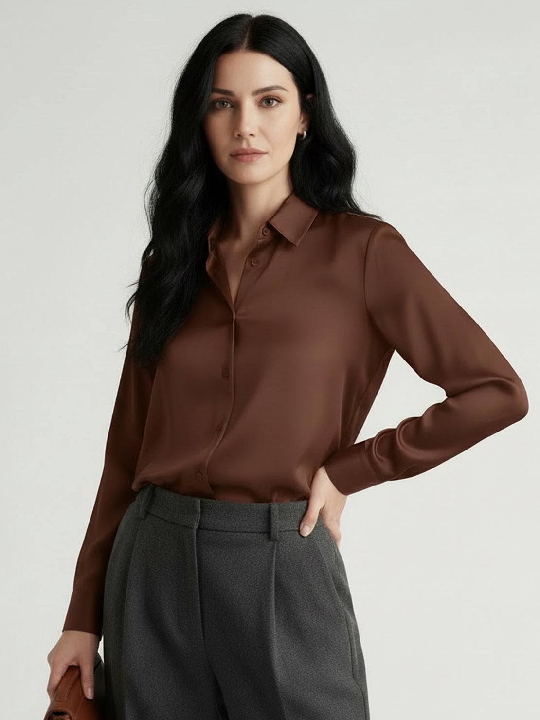 Silk-finish button front shirt with relaxed fit, traditional collar, long sleeves, and curved hem in smooth polyester blend fabric