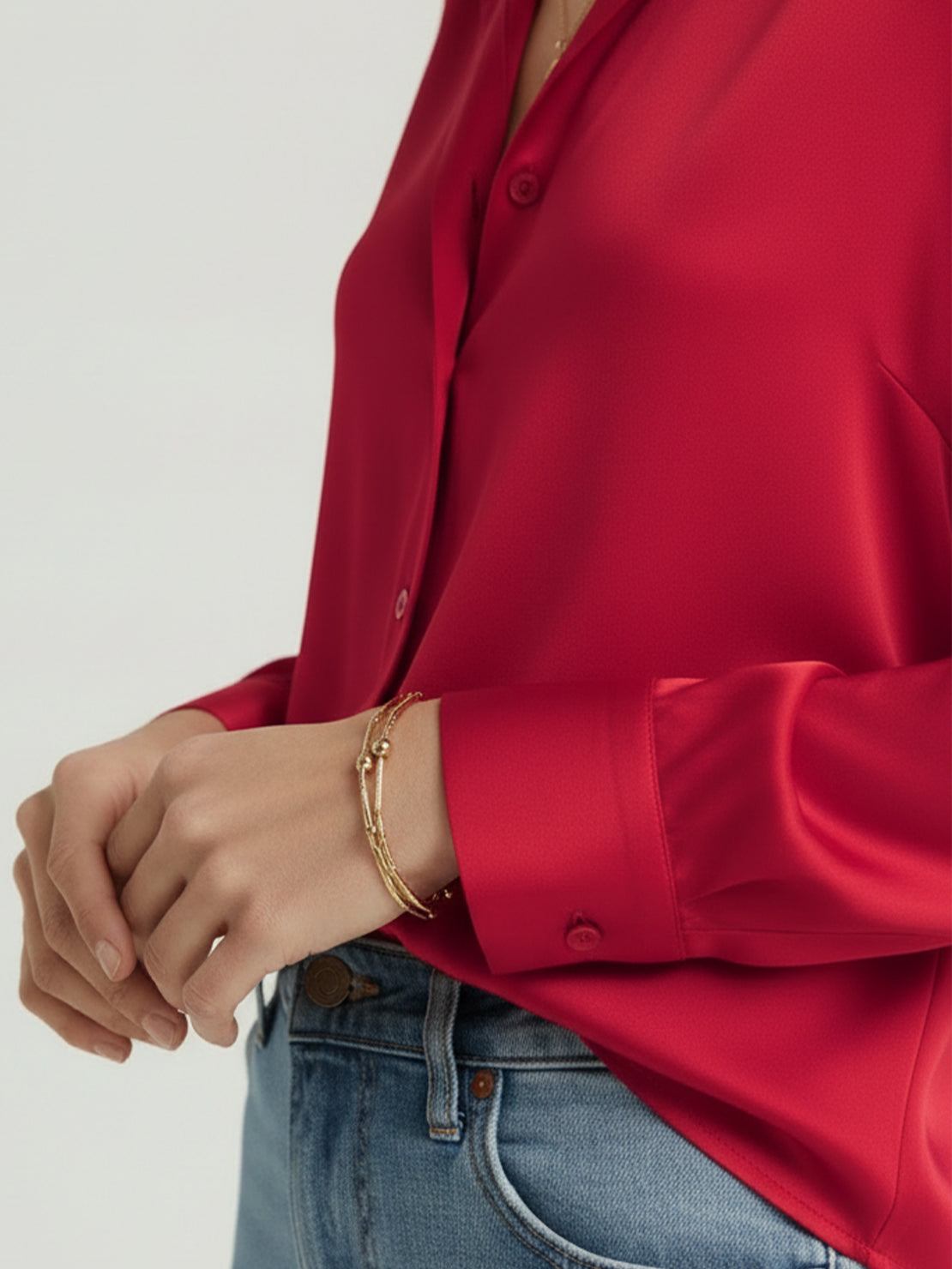 Silk-finish button front shirt with relaxed fit and curved hem in smooth polyester blend fabric