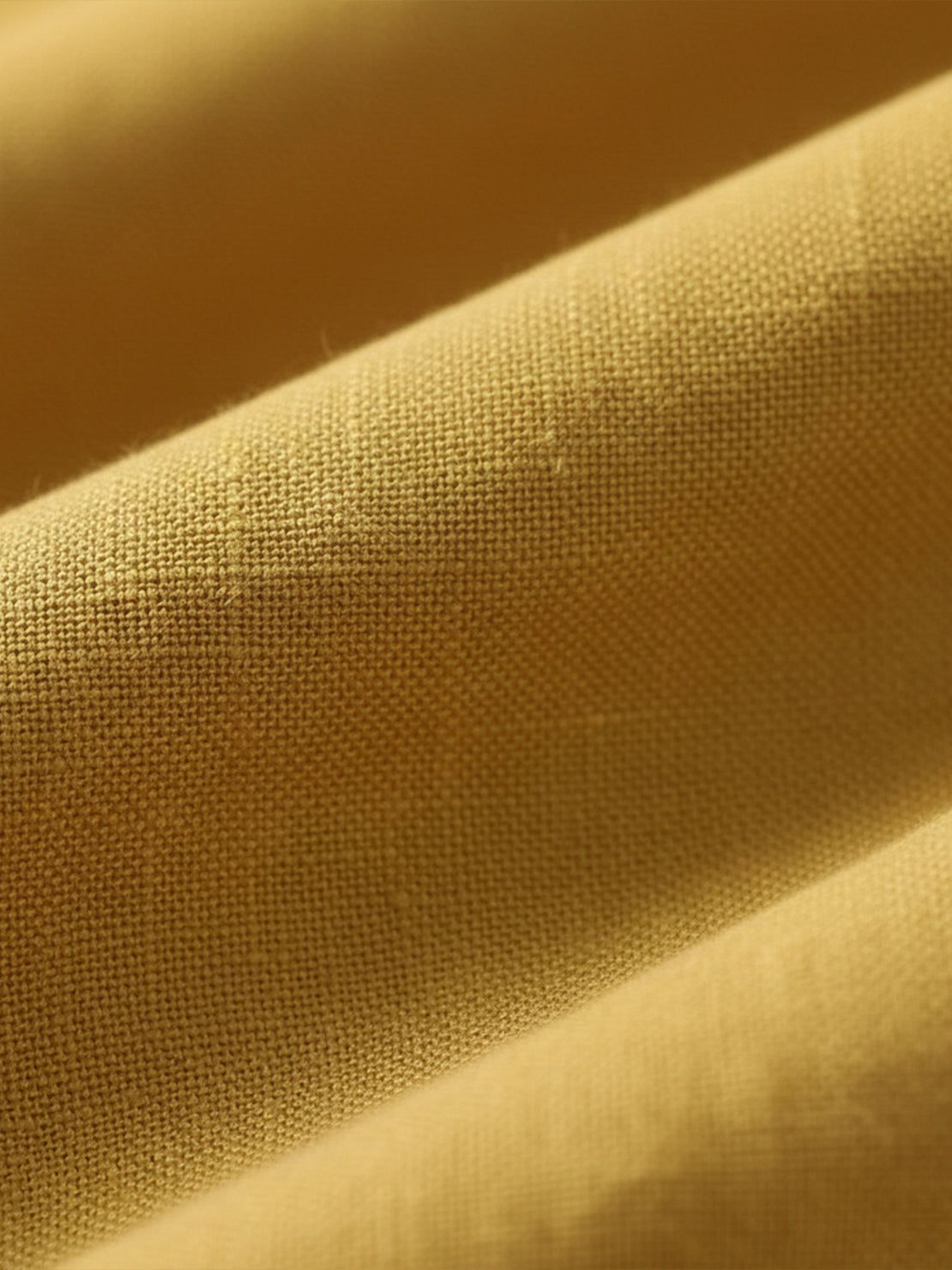 Cotton-linen blazer with relaxed fit, notch lapels, two-button front, and natural textured fabric