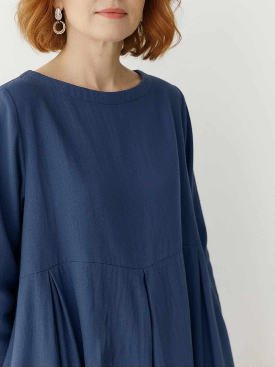 Cotton-linen empire waist dress with natural crinkle texture and A-line maxi silhouette