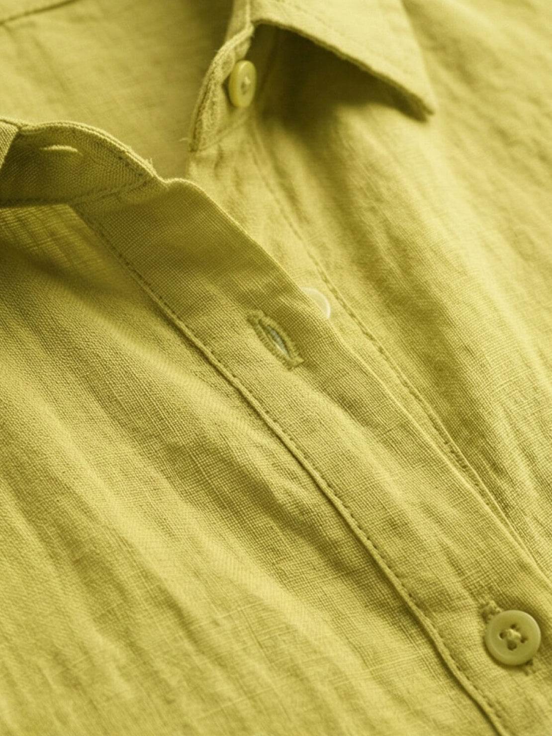 Lightweight 100% cotton popover blouse with relaxed oversized fit, classic collar, and tunic-length curved hem.