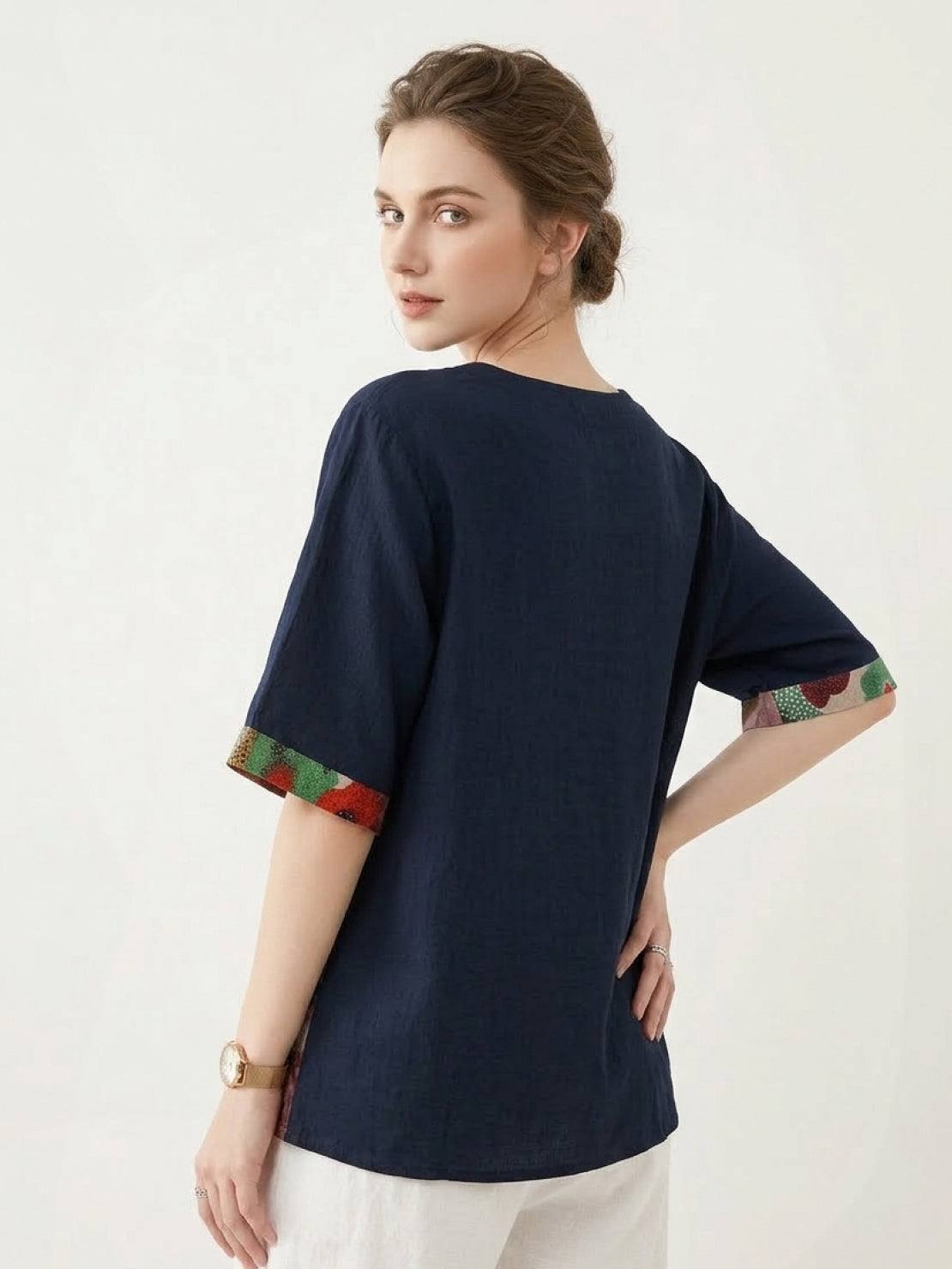 Oversized cotton linen shirt with round neckline, elbow sleeves, and floral patchwork panel