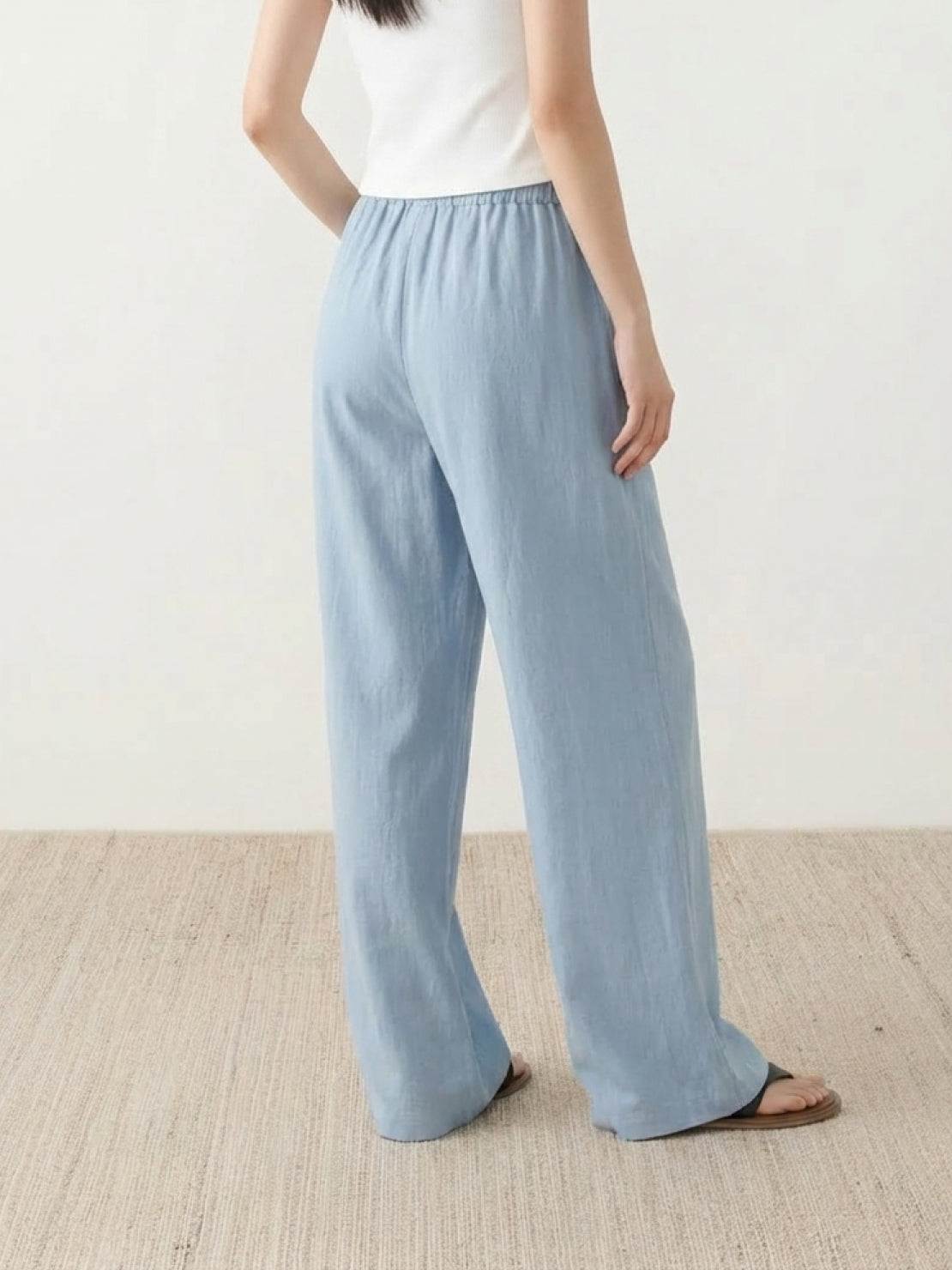 100% linen wide-leg pants with high-rise elastic waist and side pockets