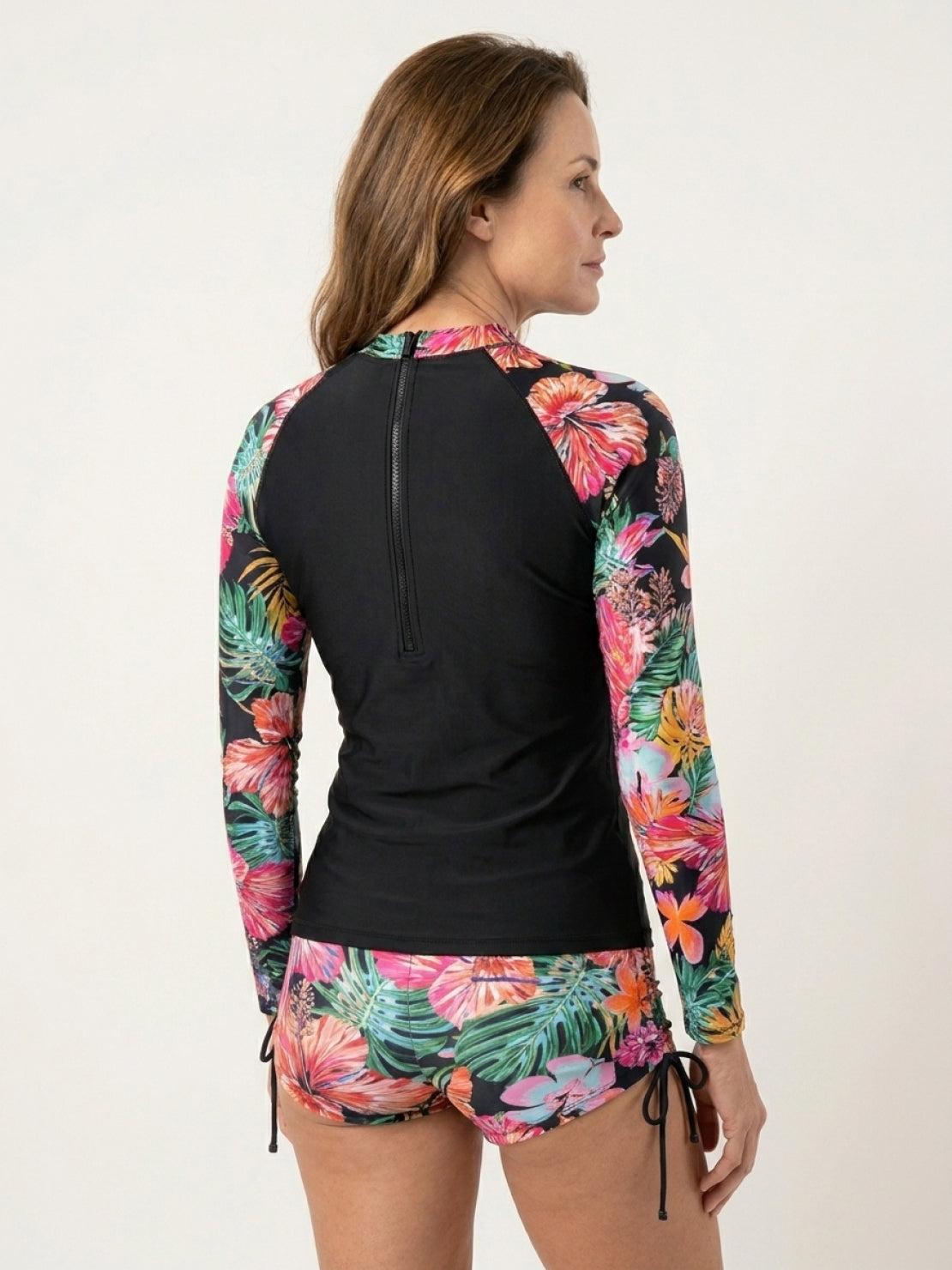 Tropical print rash guard set with long sleeves and matching boy-cut swim shorts.
