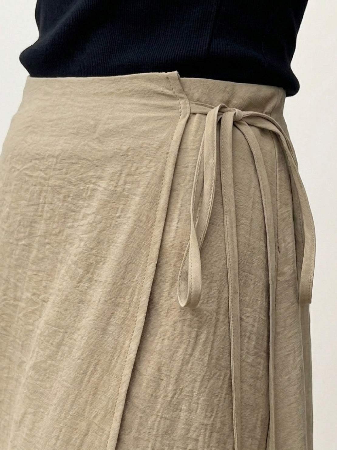 Asymmetrical wrap maxi skirt with side tie closure and flowing lightweight fabric in multiple colors