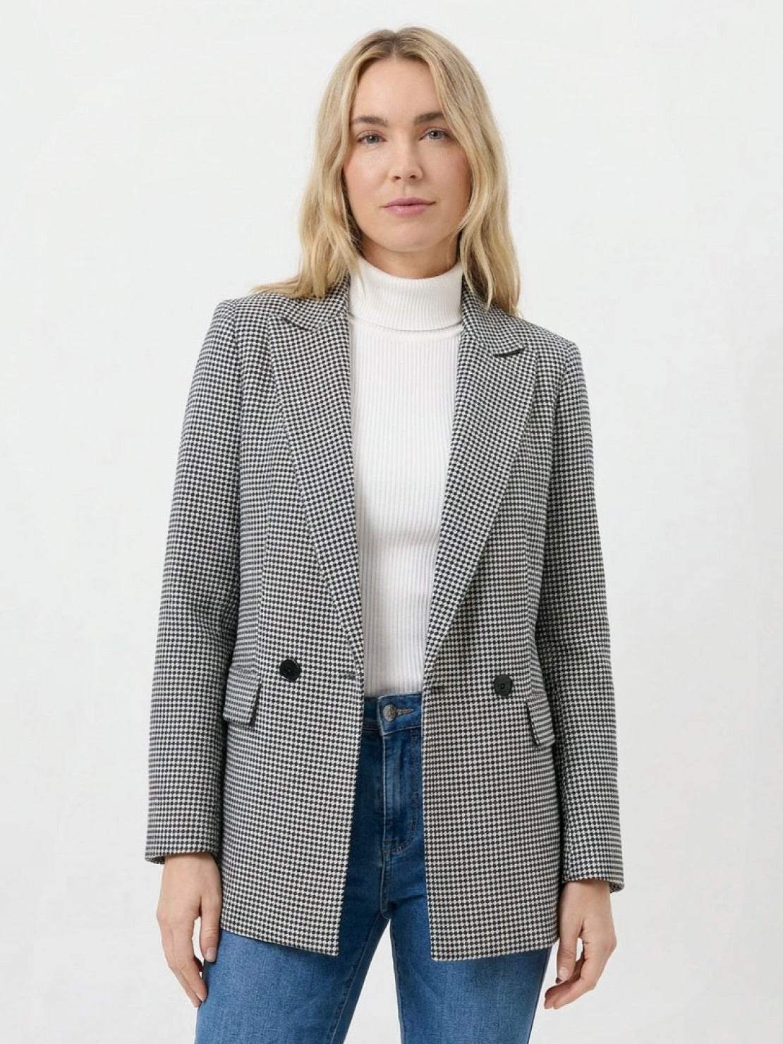 Black and white houndstooth commuter blazer with structured shoulders and relaxed fit