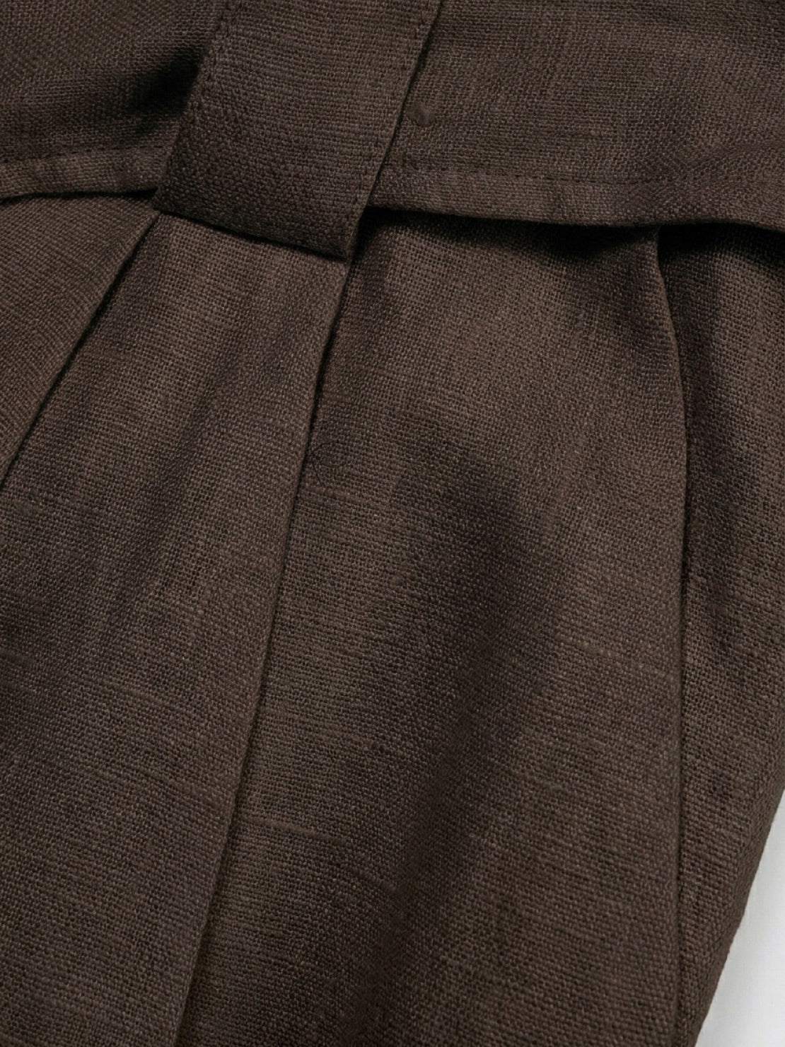 white 100% linen belted shorts with relaxed wide-leg fit and high-rise waist