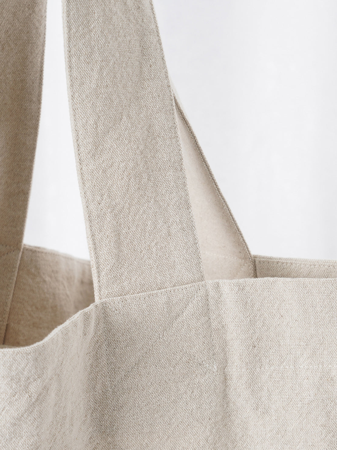 Beige cotton linen canvas shoulder bag with front pocket and comfortable straps for everyday use