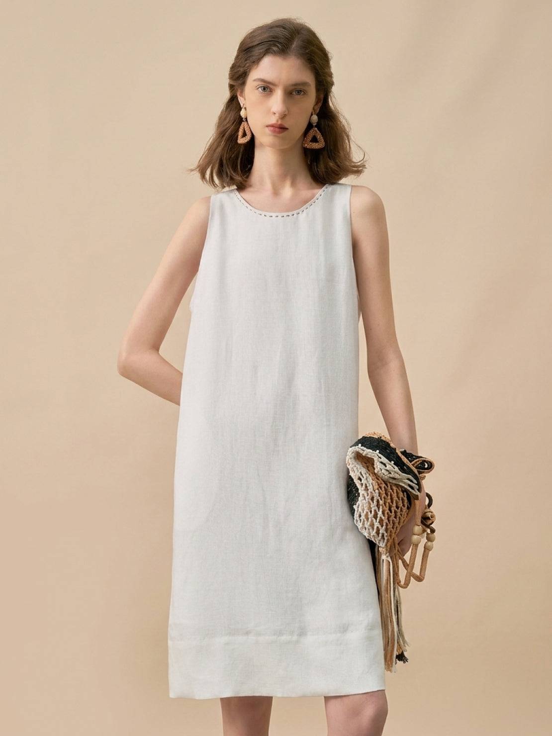 Sleeveless linen lyocell blend shift dress with relaxed A-line silhouette in white and black colors