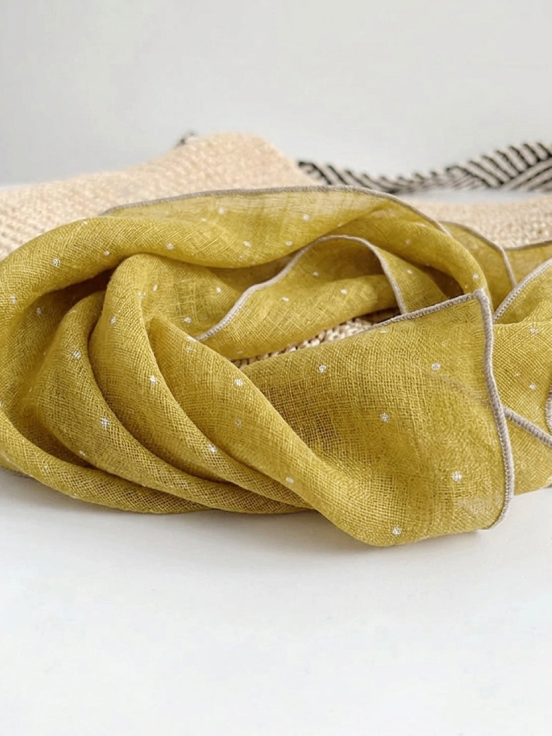 Lightweight 100% linen neck scarf with timeless checkered pattern and natural rolled edges