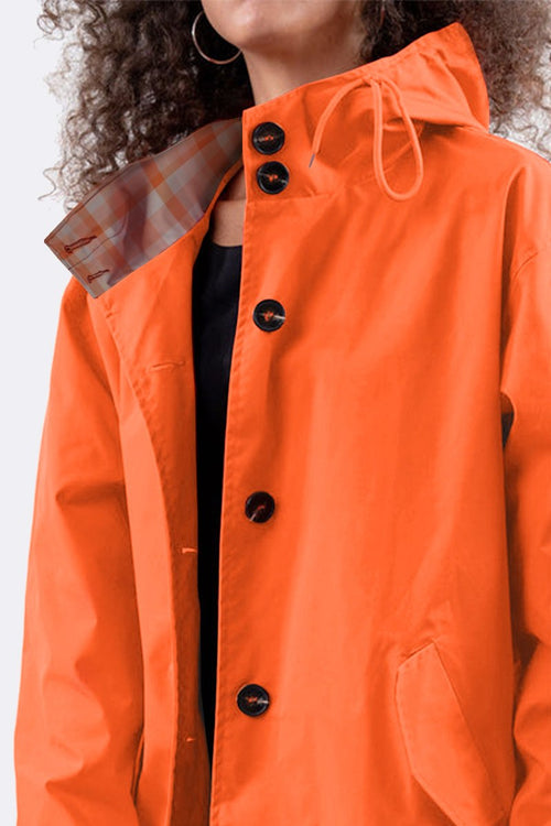Orange water-resistant oversized hooded windbreaker rain jacket with button closure and plaid inner lining