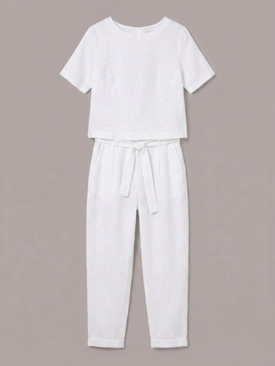 Woman wearing breathable 100% cotton linen set with relaxed short-sleeve top and straight-leg pants in monochrome tones
