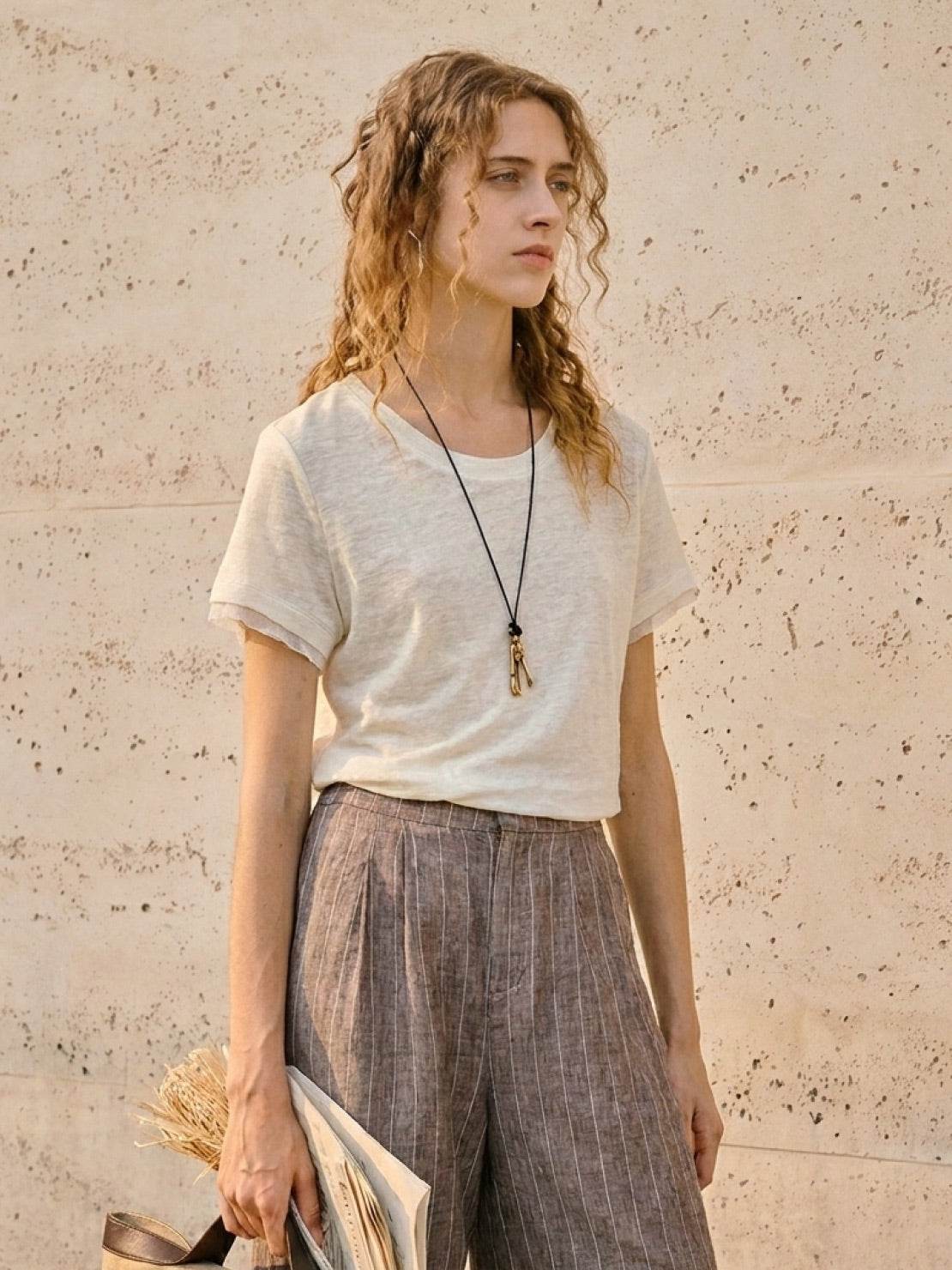 100% linen rolled cuff tee with relaxed scoop neckline and contrast inner lining