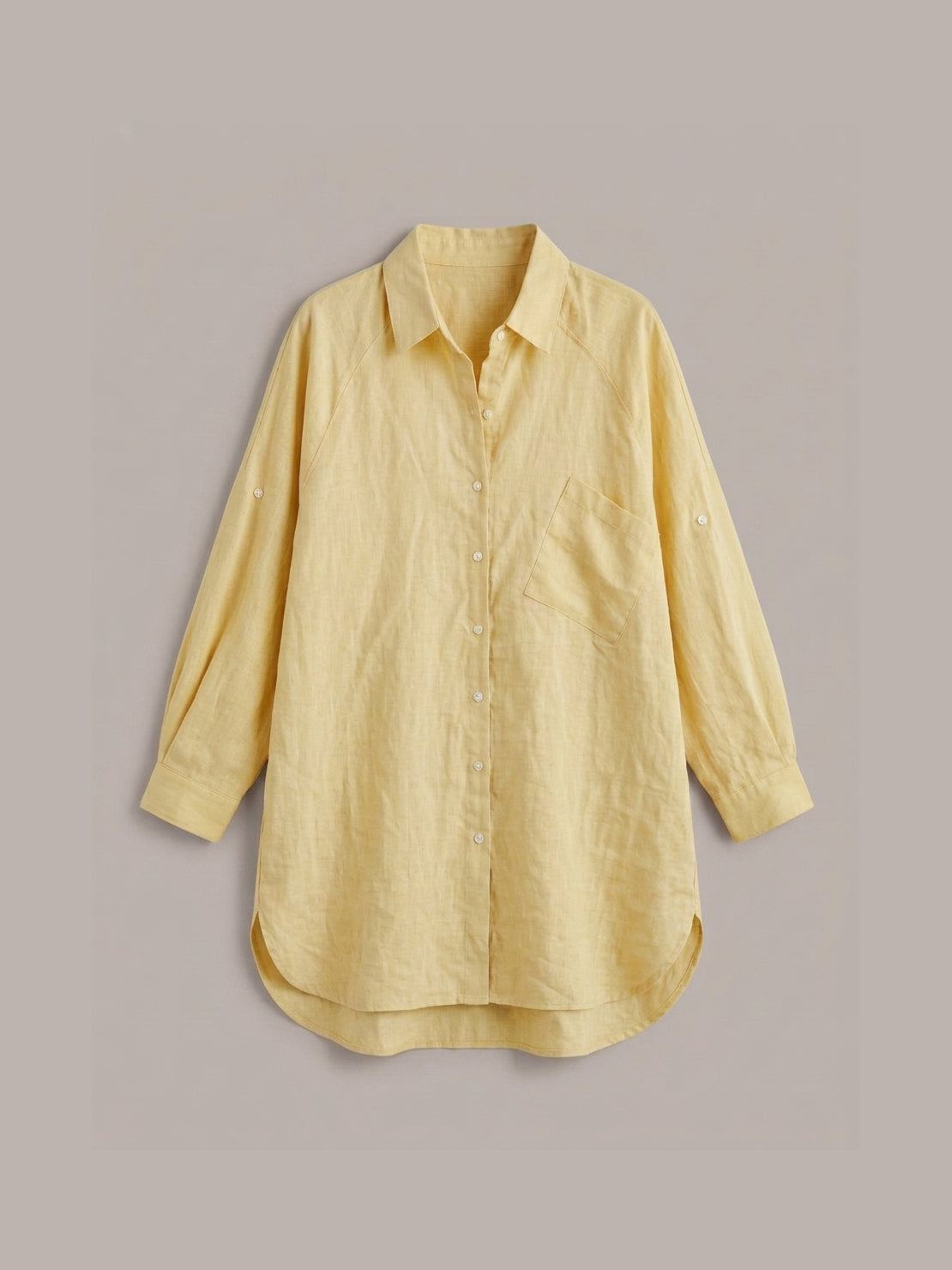 relaxed oversized 100% cotton linen shirt with dropped shoulders and back pleat detail on white background