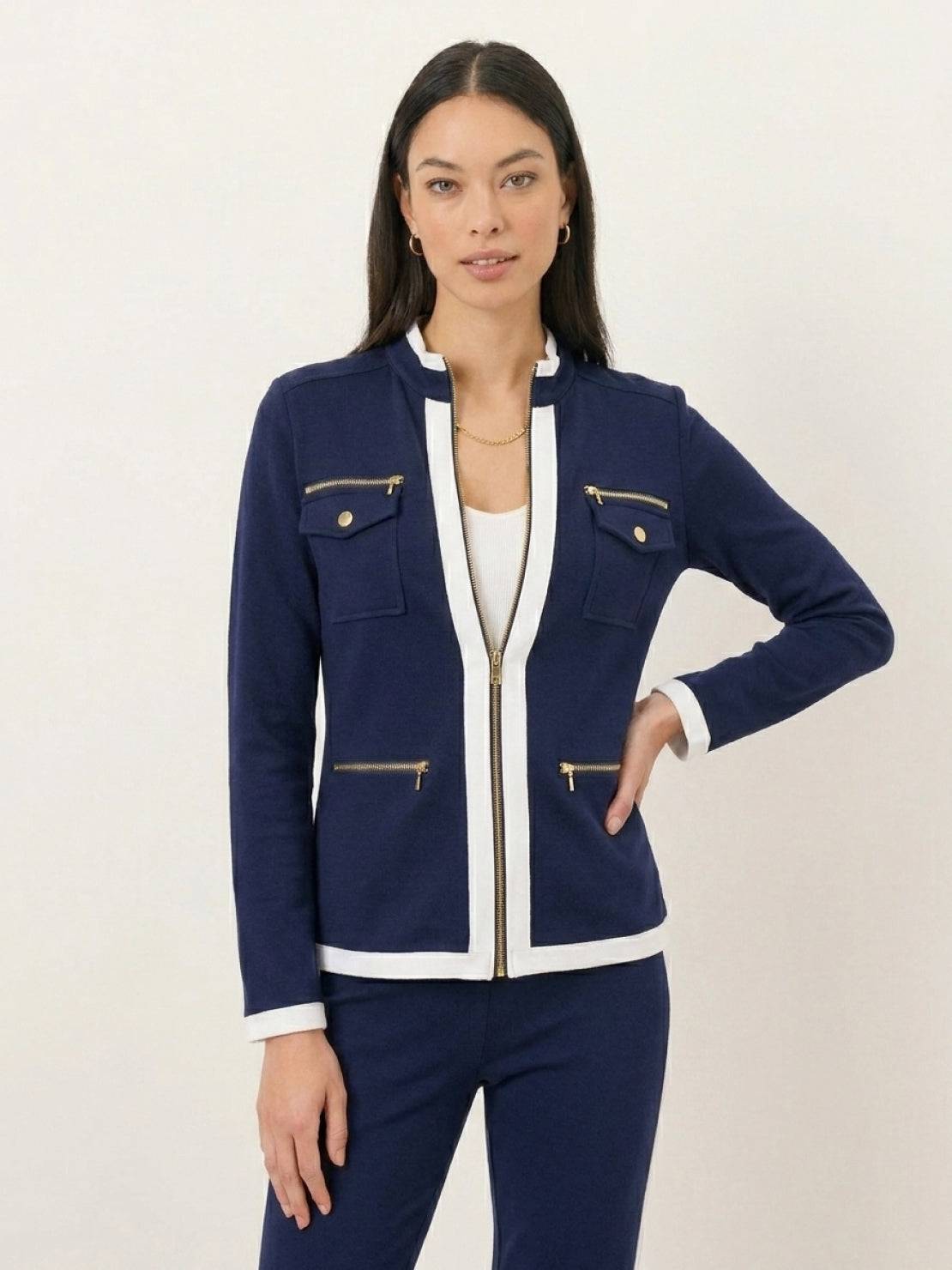 Woman wearing sleek contrast zip two-piece outfit in black and white