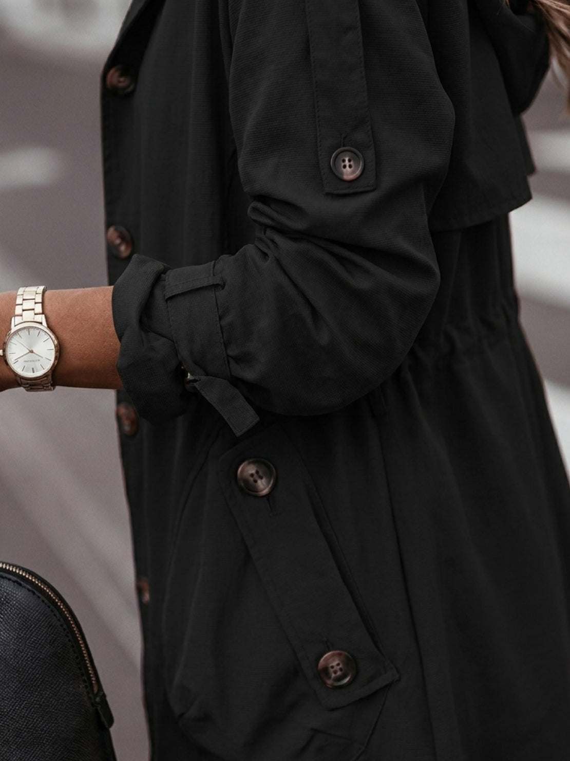 Minimalist hooded coat in oversized fit for travel and layering