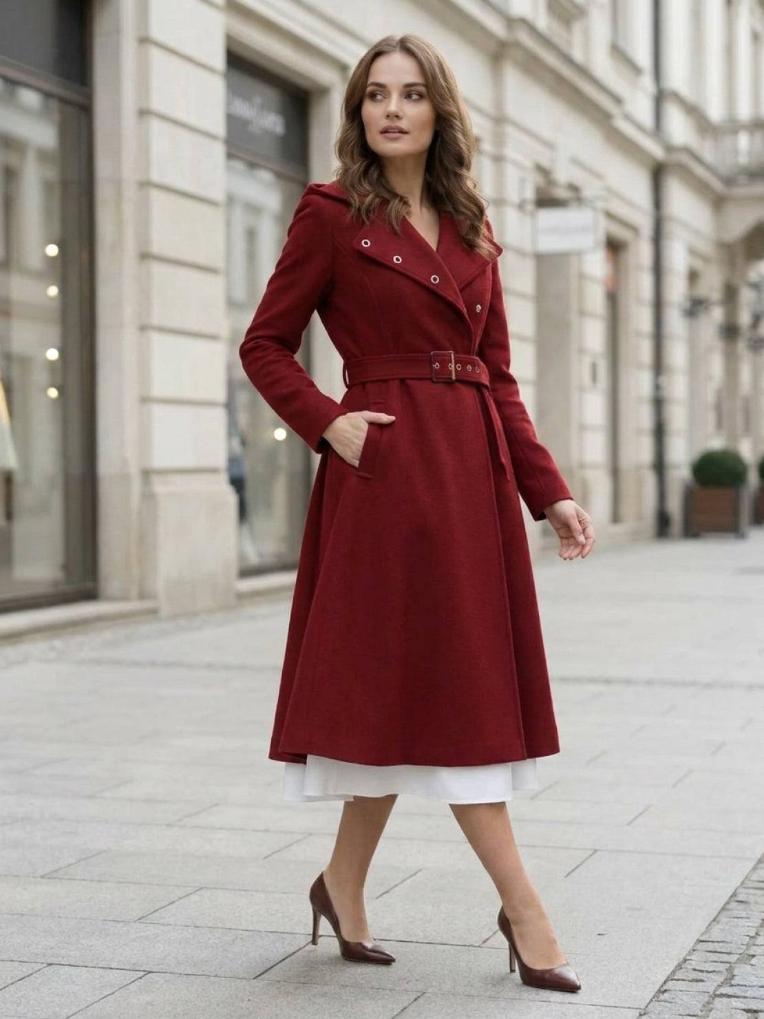 Woman wearing water-repellent A-line hooded raincoat with belt outdoors