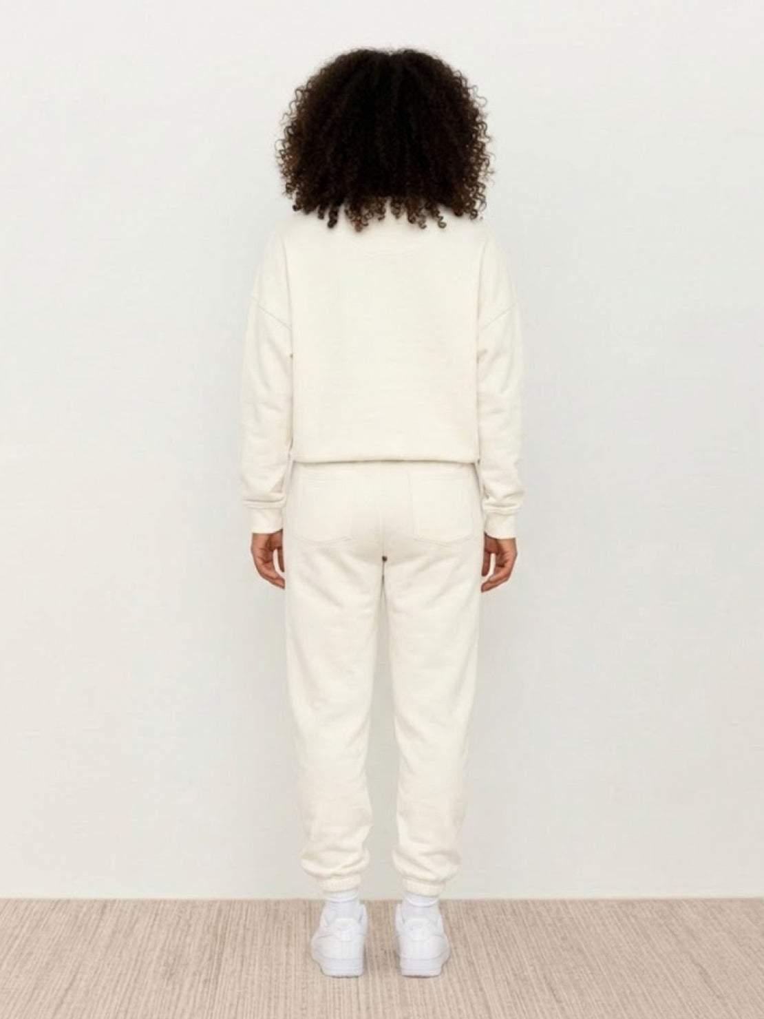 Woman wearing Classic Comfort Athleisure set in neutral tones, showcasing stretchy, flattering activewear for all-day comfort and style.