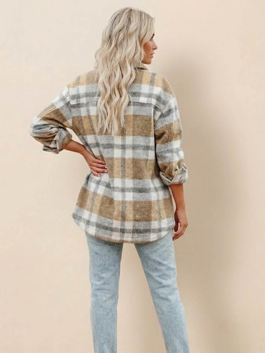 Woman wearing comfy flannel classic button-down shirt in beige and white plaid pattern from the back
