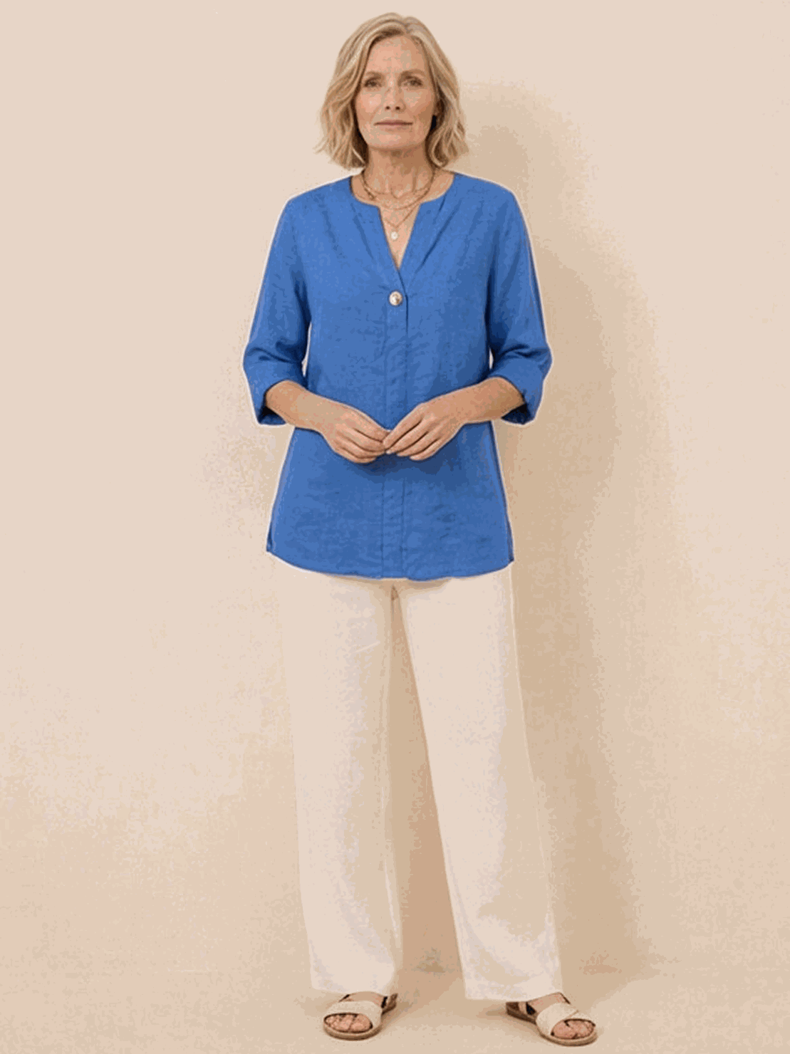 woman wearing pure linen age-defying button detail shirt in soft white