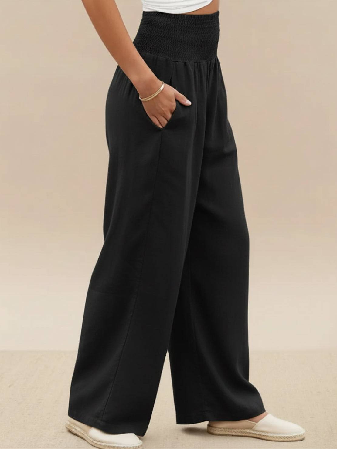 Black high-waist cotton linen palazzo pants with wide legs and pockets for women.