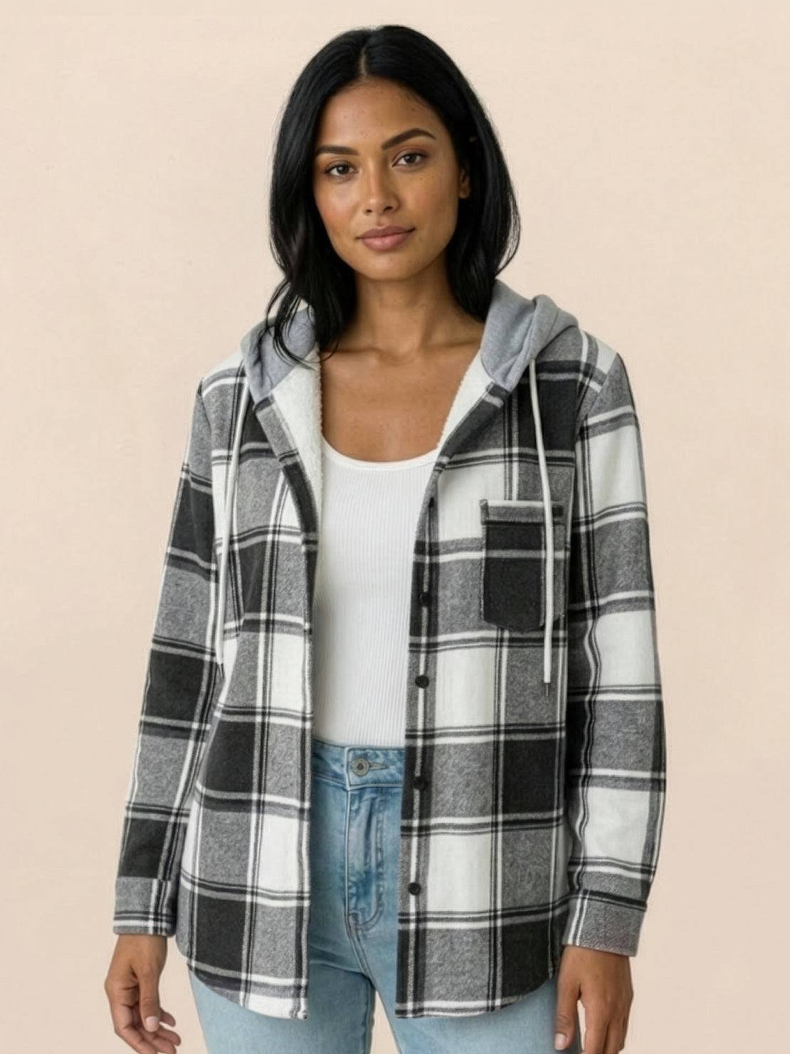 Highland Plaid Shacket with soft fleece lining, hood, button-front, and front pockets in classic plaid pattern.